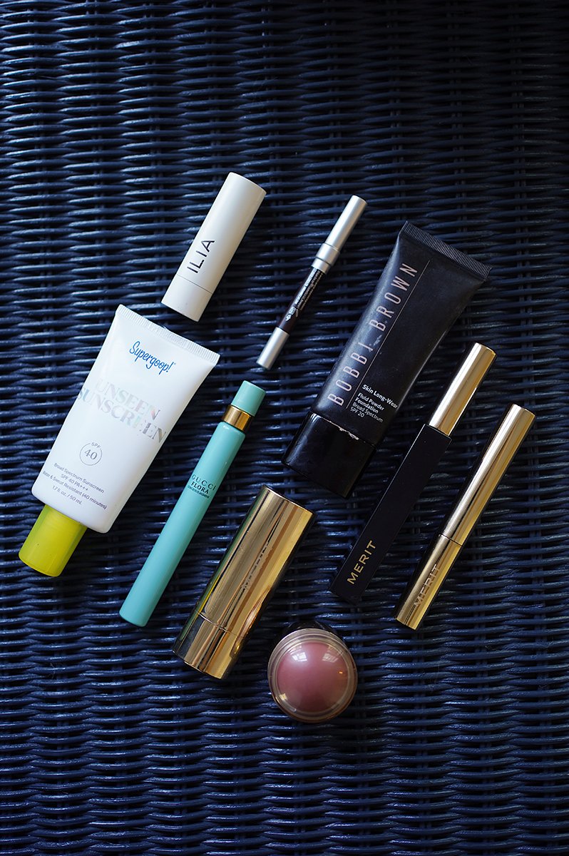 SUPERGOOP! UNSEEN SUNSCREEN, ILIA HYDRATING LIP BALM, URBAN DECAY 24/7 EYELINER, GUCCI FLORA GORGEOUS JASMINE PERFUME, BOBBI BROWN FLUID to POWDER FOUNDATION, MERIT BRONZE BALM, MERIT CLEAN LASH MASCARA, MERIT FLUSH BALM CREAM BLUSH, MERIT 1980 BROW GEL